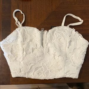 Revamped white lace bralette with zipper back.